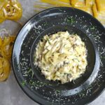 Keto chicken Alfredo casserole with melted mozzarella cheese, garnished with fresh parsley. A creamy, low-carb comfort meal.