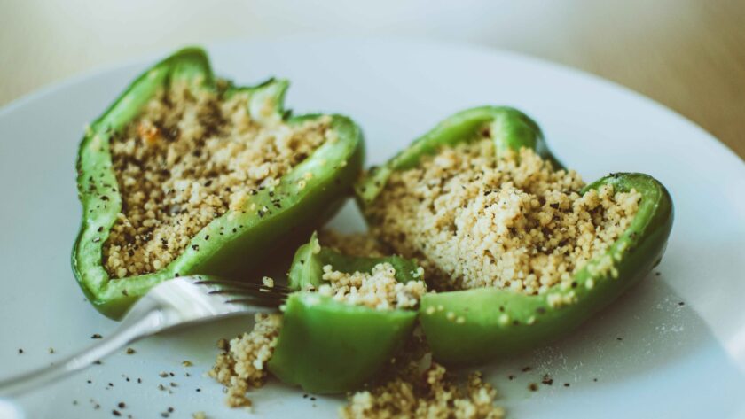 Vegetarian Stuffed Peppers served on white plate.