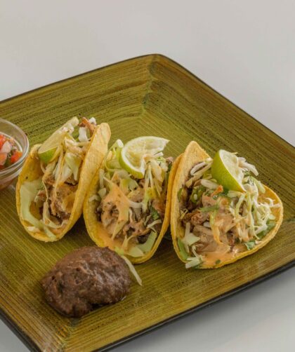 Grilled Fish Tacos Recipe served on a green plate.