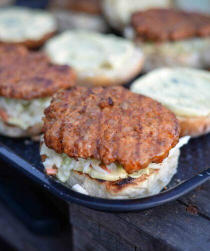 Grilled Black Been burgers placed on salver on wooden table.