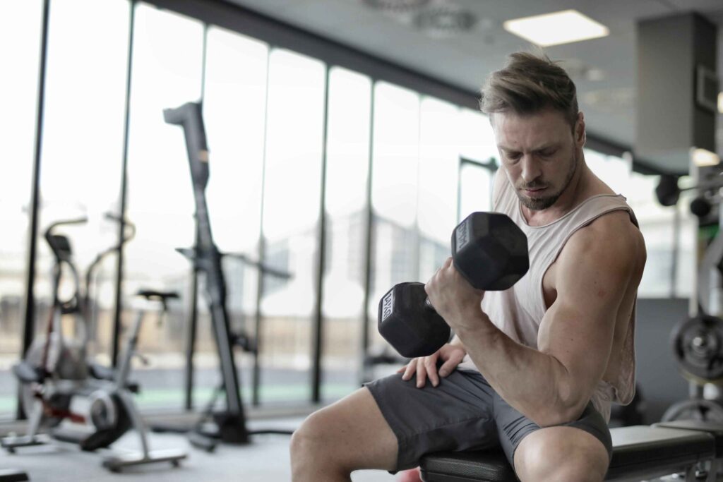 Men doing workout in gym.