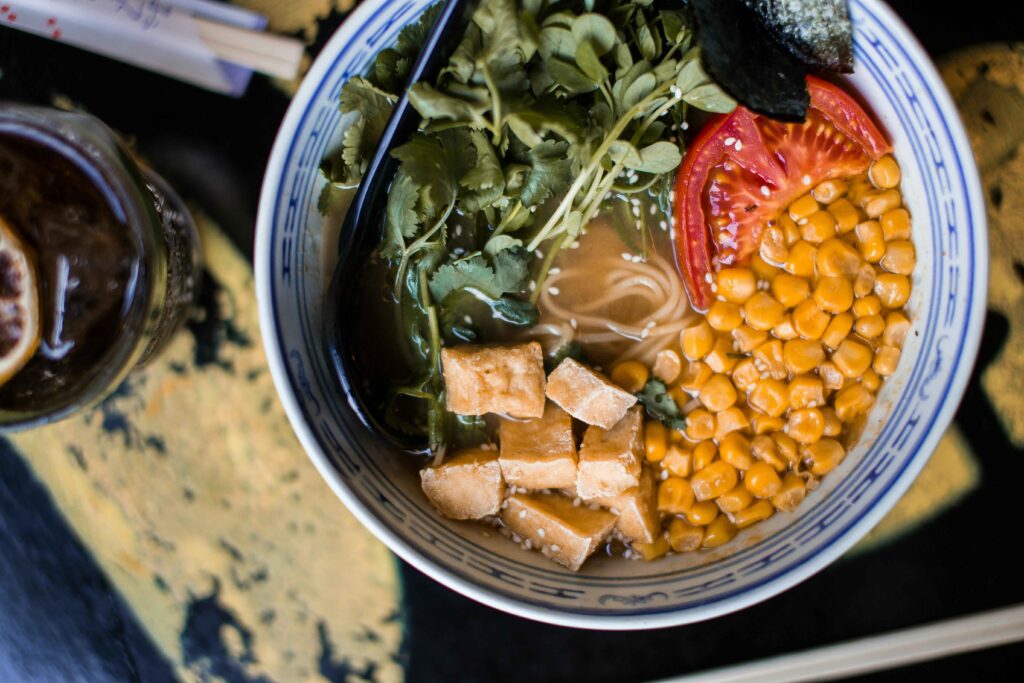 Corn Soup served in a bowl with some vegetables