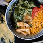 Corn Soup served in a bowl with some vegetables