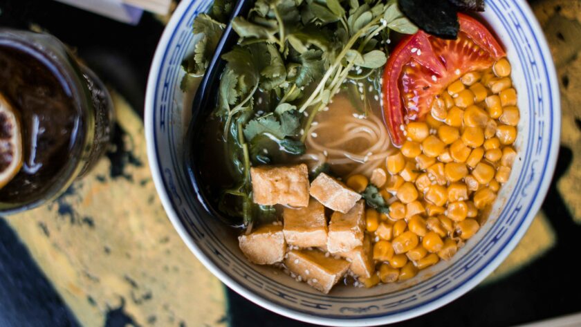 Corn Soup served in a bowl with some vegetables