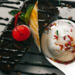 Vanilla ice cream served in a spoon with pastry.