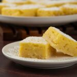 Two Dhokla served on a white plate