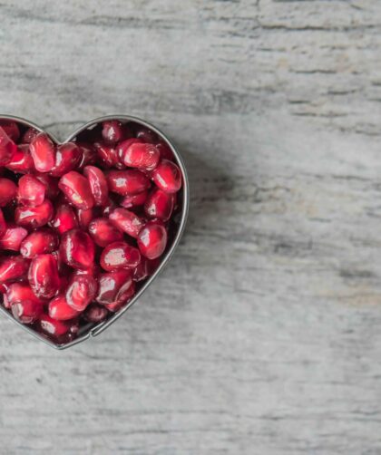 Silver Heart Bowl Filled of Red Pomegranate Seeds