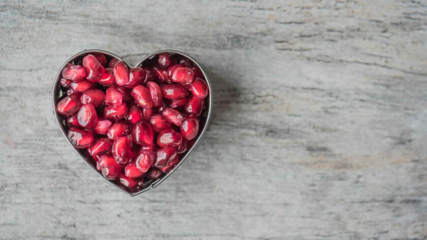 Silver Heart Bowl Filled of Red Pomegranate Seeds