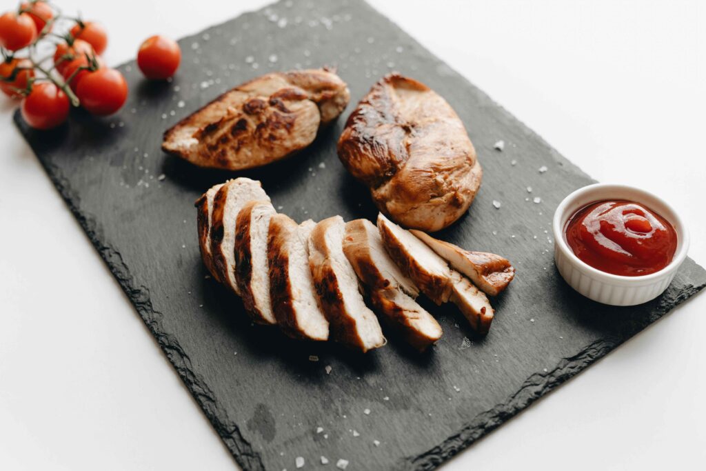 Baked Chicken Breast served in a black tray