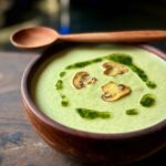 Green Mushroom Soup in a wooden Bowl