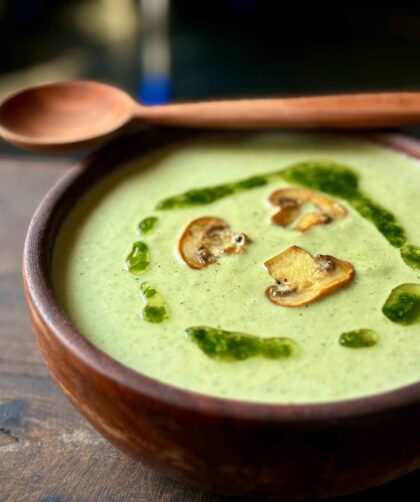 Green Mushroom Soup in a wooden Bowl