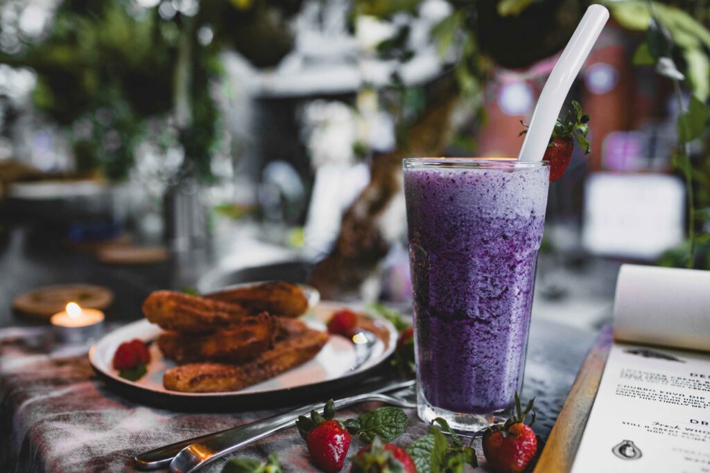 Berry Smoothie in a glass with straw