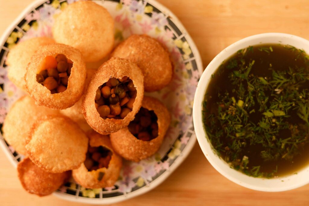 Pani puri served in plate and Pani puri water served in a Bowl