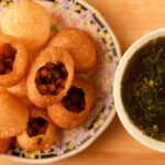 Pani puri served in plate and Pani puri water served in a Bowl