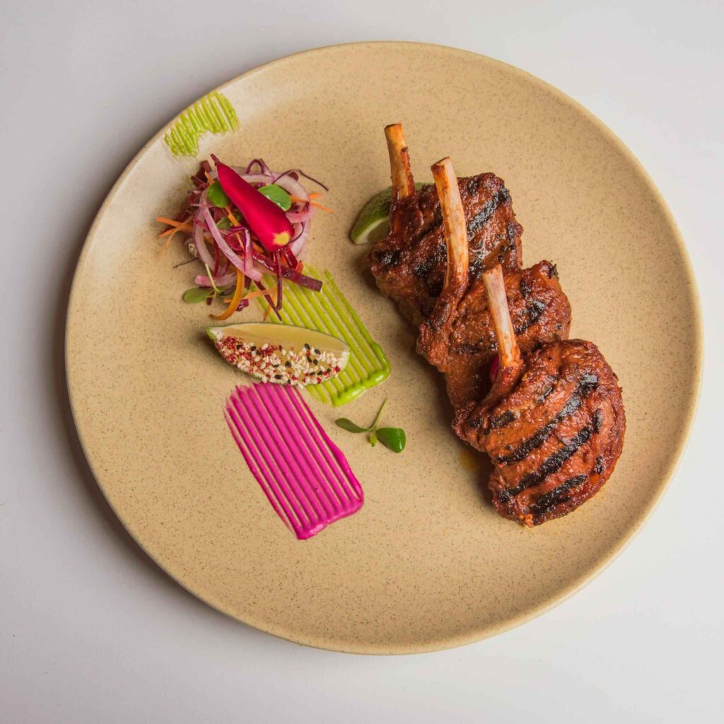 pexels-razaneadra-13304044 (1) Lamb Lollipop served with lemon
