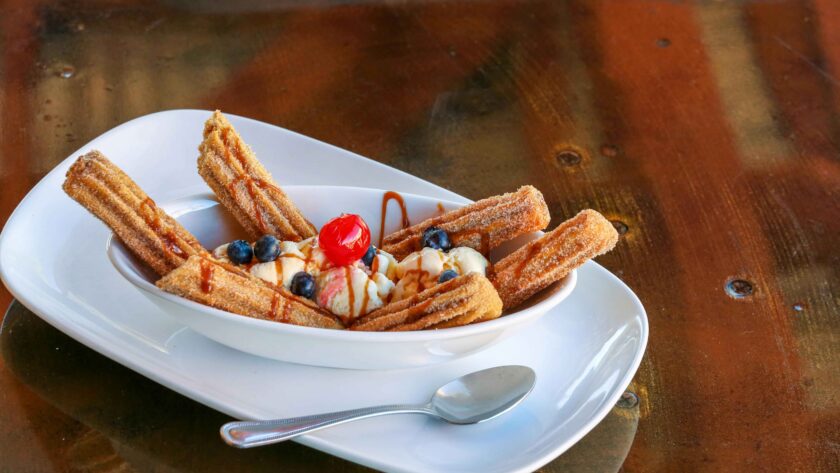 Churros Recipe served in a white tray