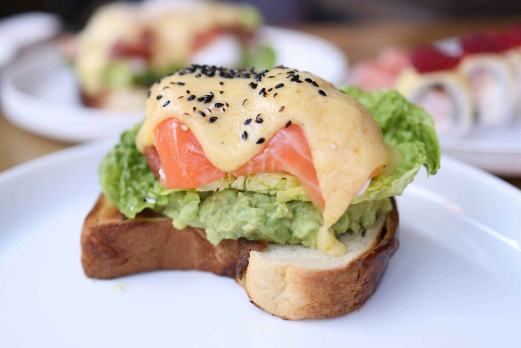 Mini Salmon Club sandwich served on a white plate