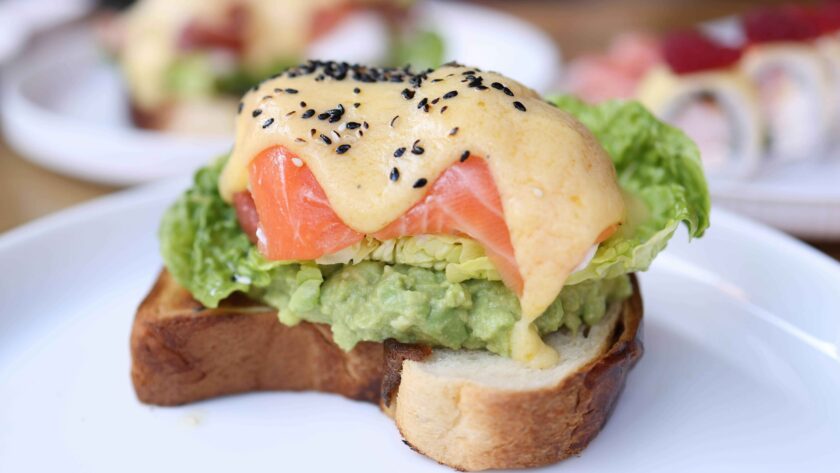 Mini Salmon Club sandwich served on a white plate