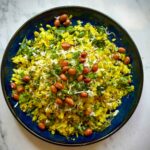 Best Homemade Poha serves on a black plate