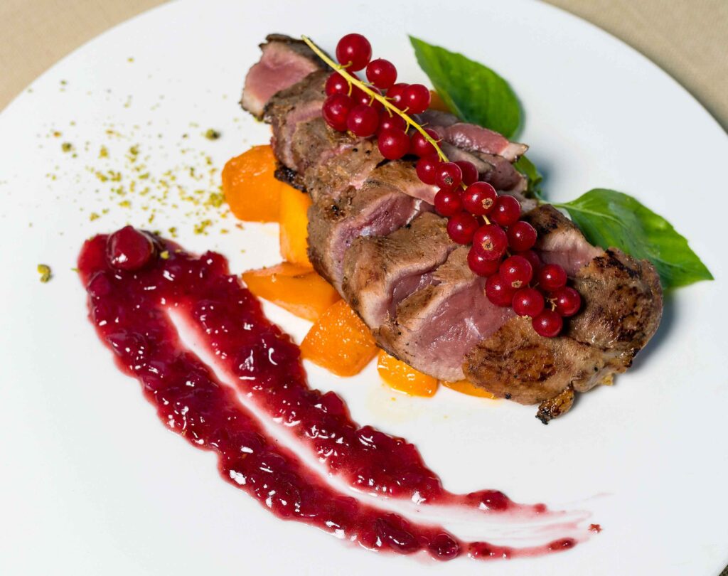 French Duck Breast served in a white plate