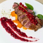 French Duck Breast served in a white plate