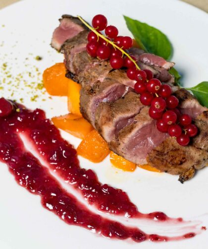 French Duck Breast served in a white plate
