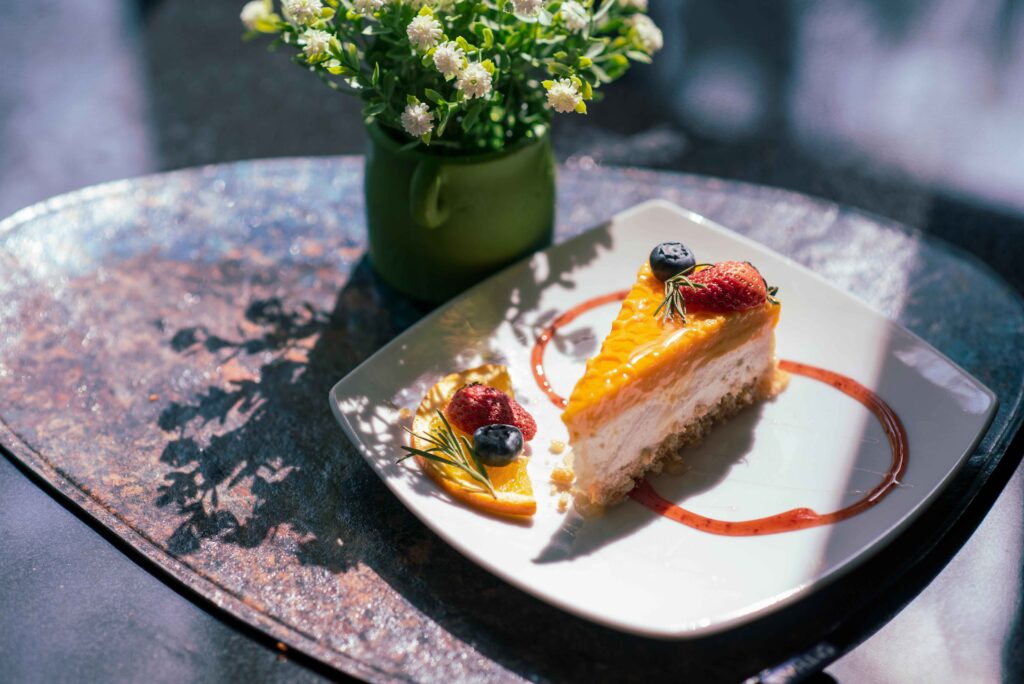 Mango Cheesecake served on a white plate