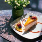 Mango Cheesecake served on a white plate