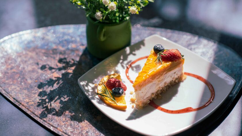 Mango Cheesecake served on a white plate