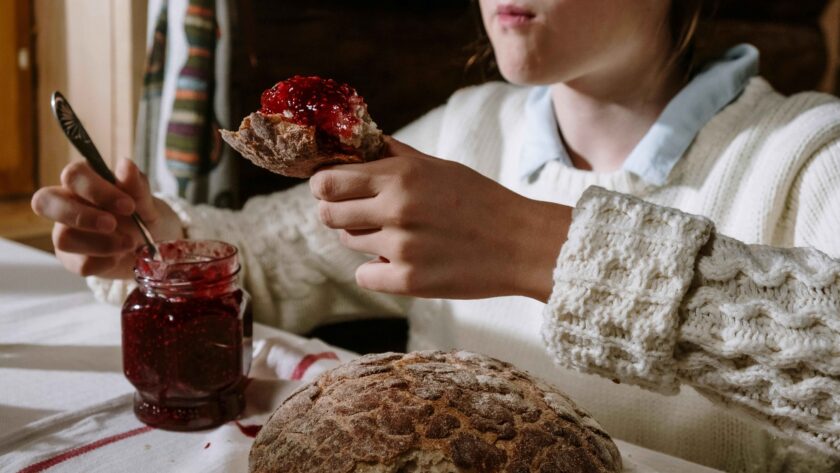 A girl is eating Watermelon Jam