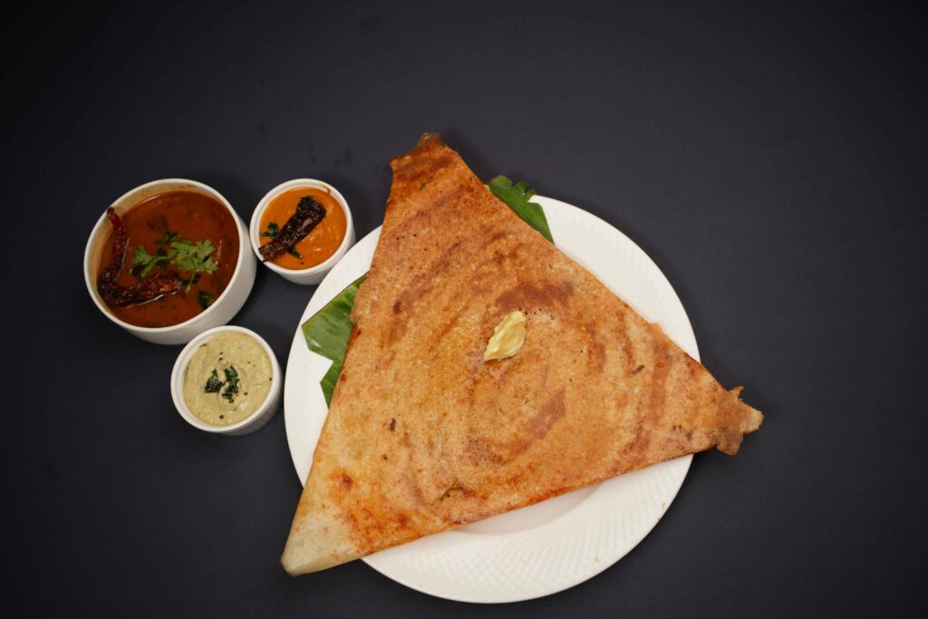 Paneer Dosa served on a white plate