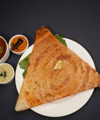 Paneer Dosa served on a white plate