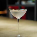 Lychee Martini is served in a glass