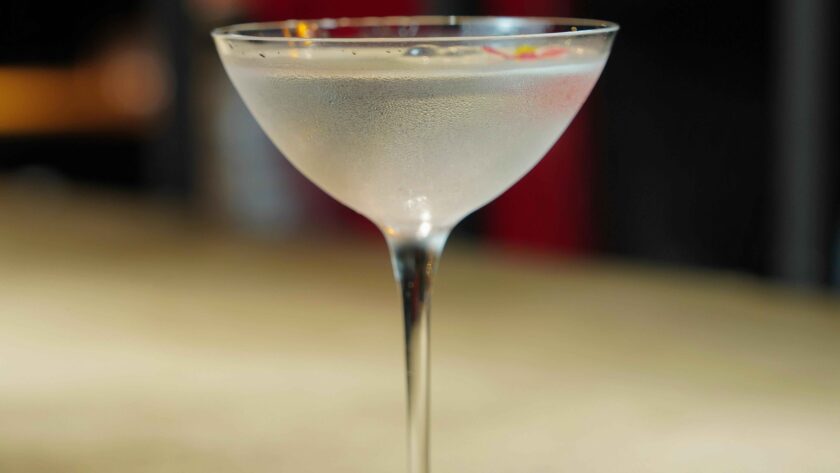 Lychee Martini is served in a glass