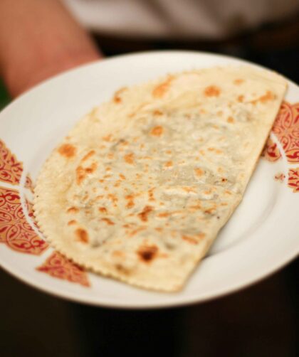Onion Paratha served on a white plate