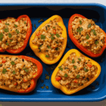 Baked Tuna Stuffed Peppers served in a blue tray