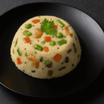 South Indian Upma served on a black plate