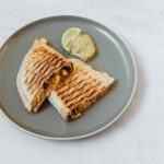 Cheese corn sandwich served on a grey plate